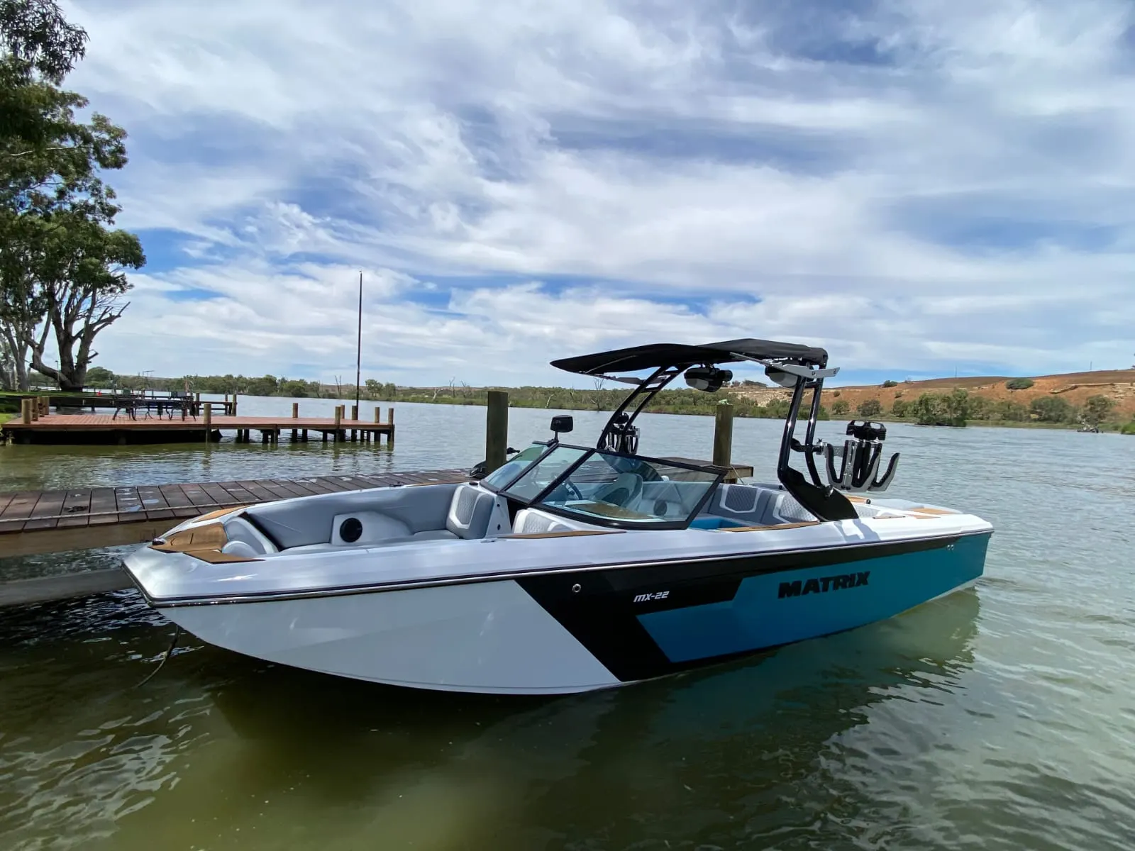 MX22 moored at a river jetty