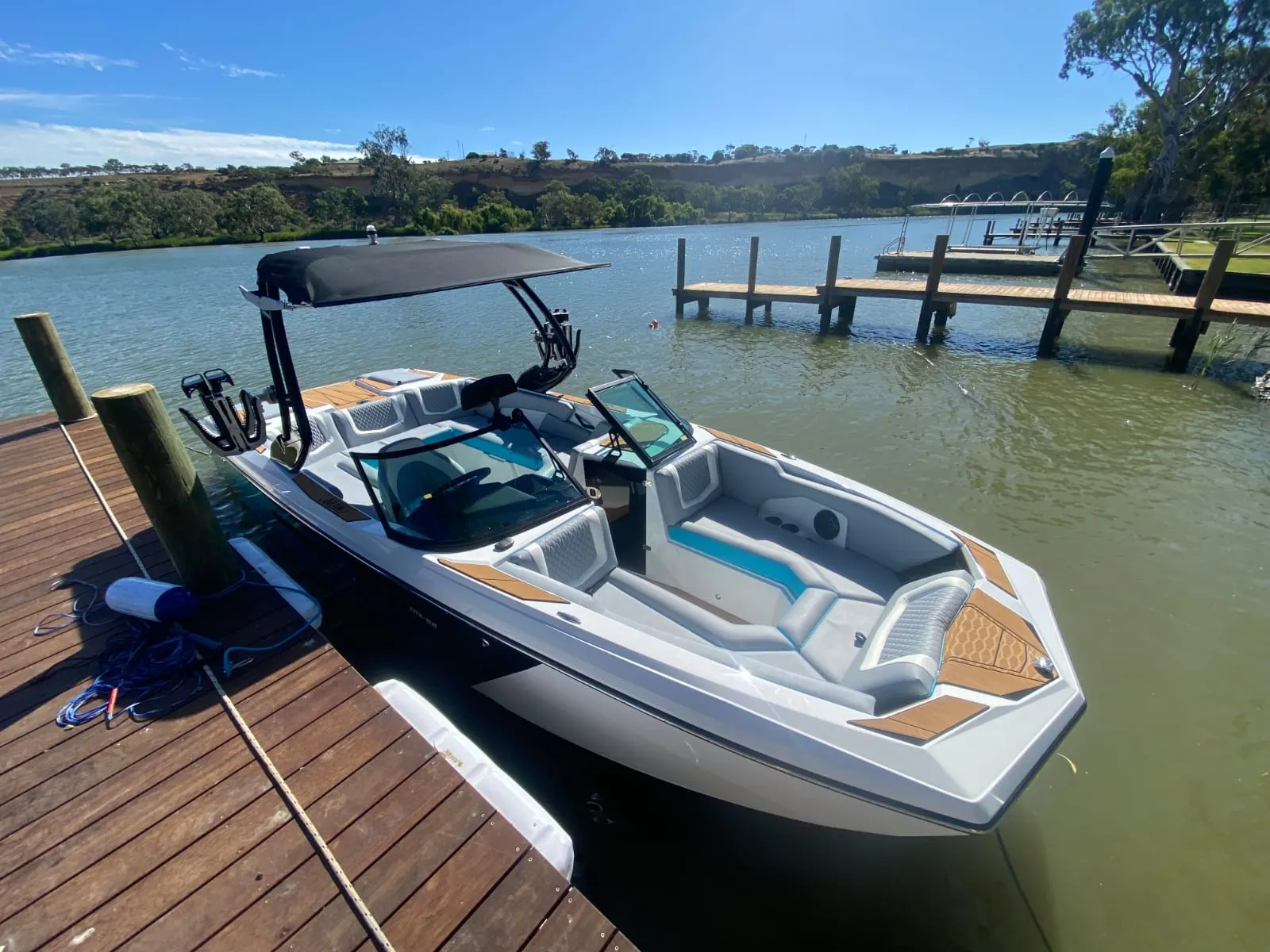 MX22 tied up at a jetty, cockpit from above