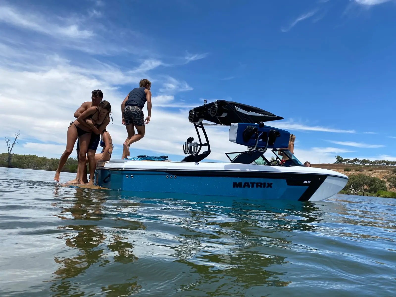 Family climbing aboard an MX22