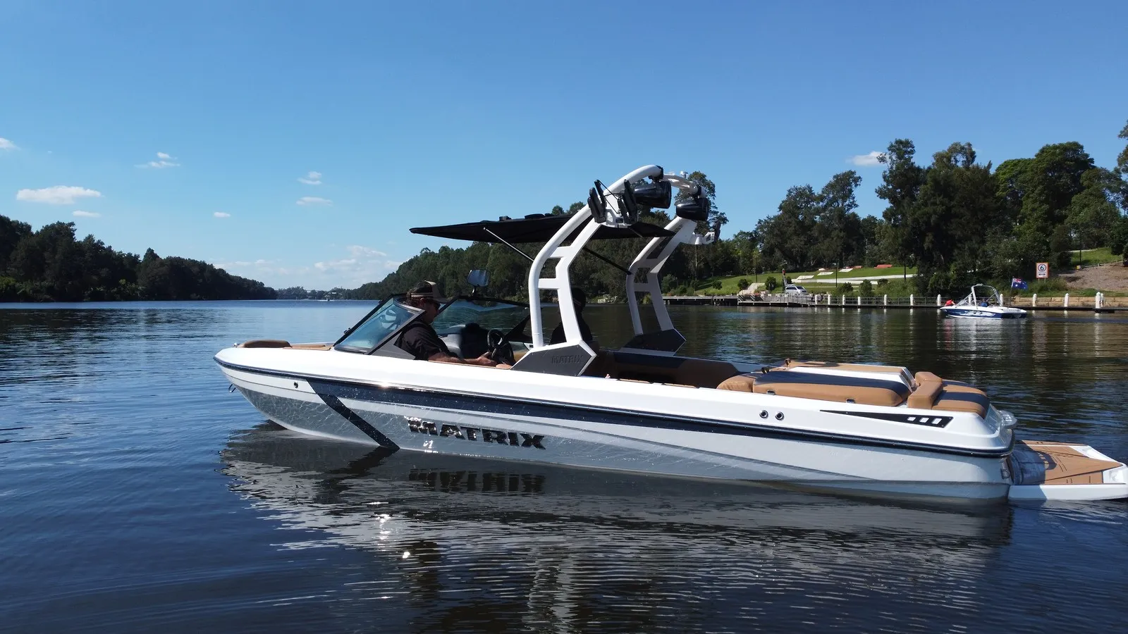 White MXV with the current Matrix tower on a calm river