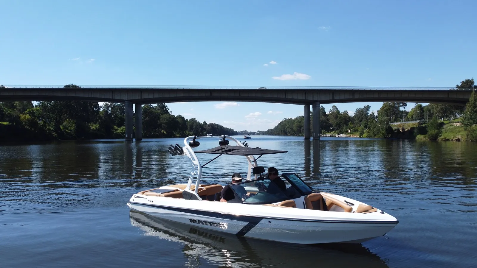 White Matrix MXV on the river below a road bridge