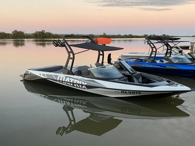 Super Sport at dusk on a still river