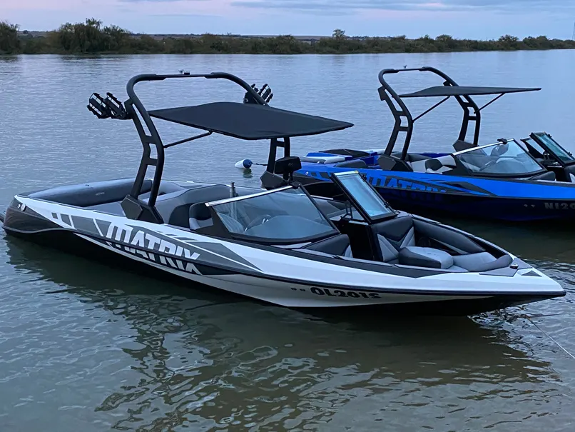Super Sport in silver next to a blue Matrix