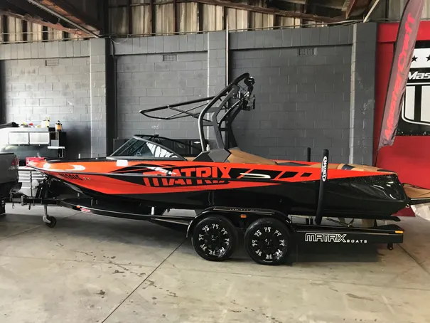 Super Sport in orange on its trailer